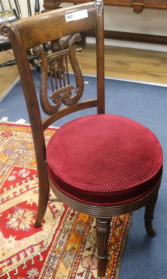 An early 19th century mahogany music chair, with revolving seat, H.86cm